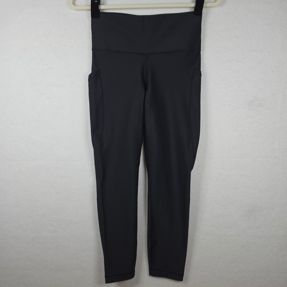 Athleta Interval Stash 7/8 Tight Leggings Small Black Side Pockets